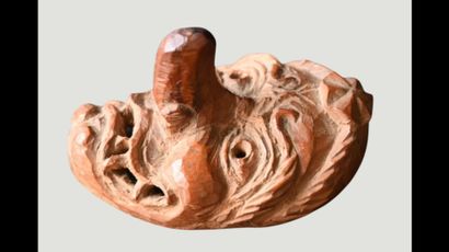 Japanese wooden Netsuke depicting a grotesque...