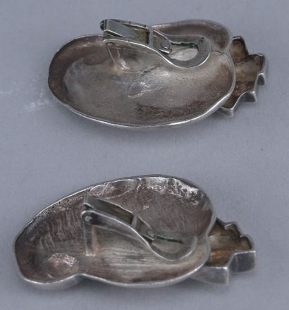 Pair of silver and gold earrings

Pair of...