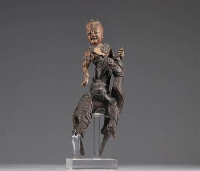 Chinese Sculpture of a Figure Riding a Dragon

A...