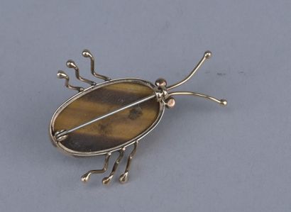 14-karat gold scarab brooch with tiger’s...