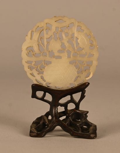 Openwork jade plaque on wooden base, China,...