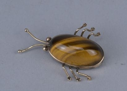 14-karat gold scarab brooch with tiger’s...