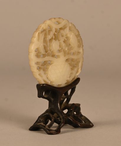 Openwork jade plaque on wooden base, China,...