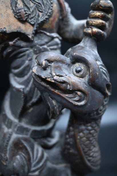 Chinese Sculpture of a Figure Riding a Dragon

A...