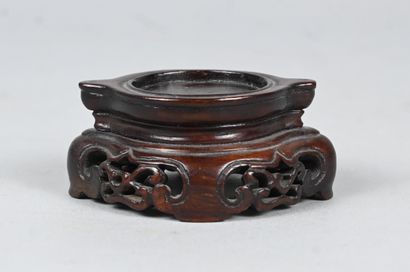 White jade bowl with carved handles on wooden...
