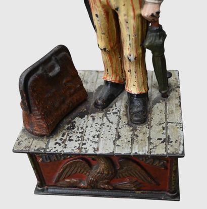 Mechanical “Uncle Sam” piggy bank made of...
