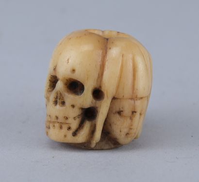 Memento Mori Rosary Bead with Four Faces

A...