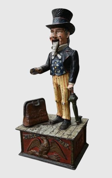 Mechanical “Uncle Sam” piggy bank made of...