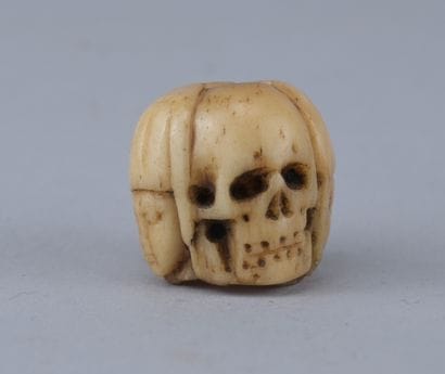 Memento Mori Rosary Bead with Four Faces

A...
