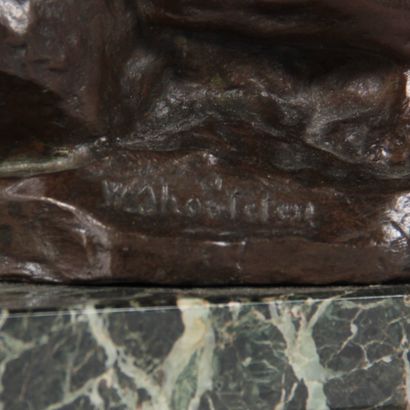 Patinated bronze sculpture depicting two...