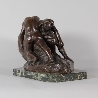Patinated bronze sculpture depicting two...