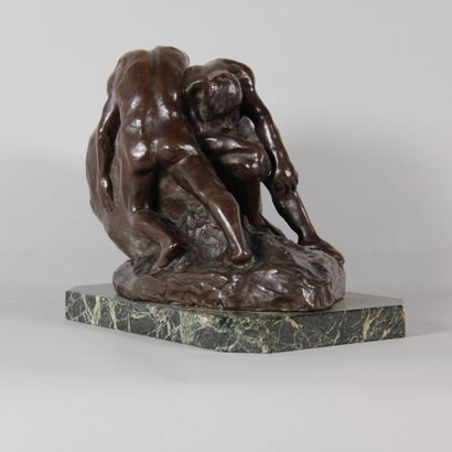 Patinated bronze sculpture depicting two...