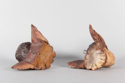 Pair of winged cherub heads carved from wood,...