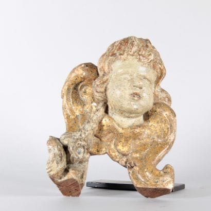 Carved, polychrome, and gilded wooden head...