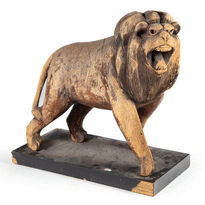 Carved wooden merry-go-round representing...