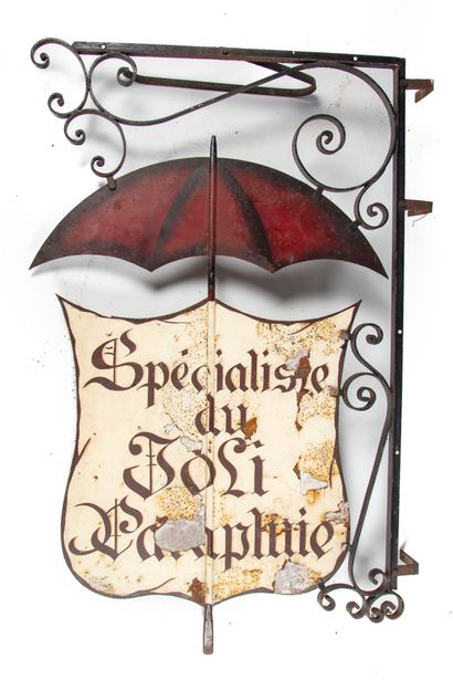 Exterior sign of a store with a wrought iron...