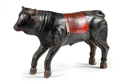 ANONYMOUS

Polychrome carved wood bull forming...