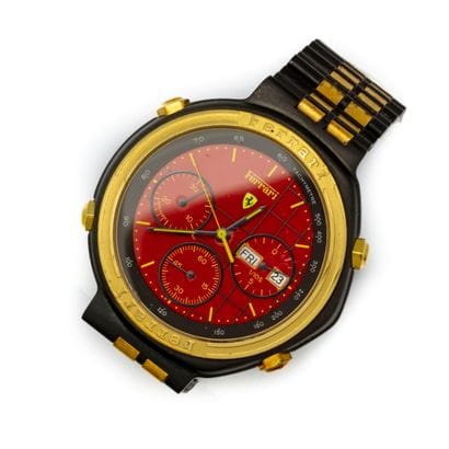 FERRARI
Montre chronographe en acier et plaqué...