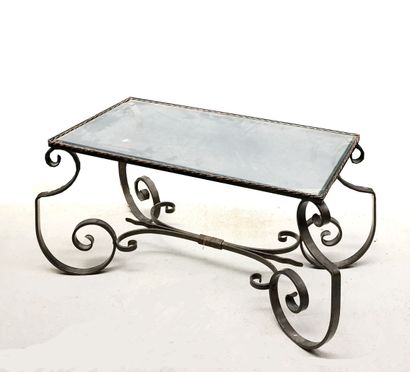 Coffee table with wrought-iron base and glass...
