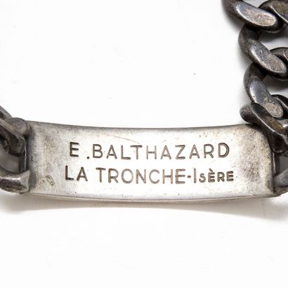 Lot comprising a silver bracelet, the engraved...