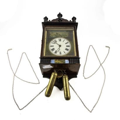 Varnished, molded wooden wall clock featuring...