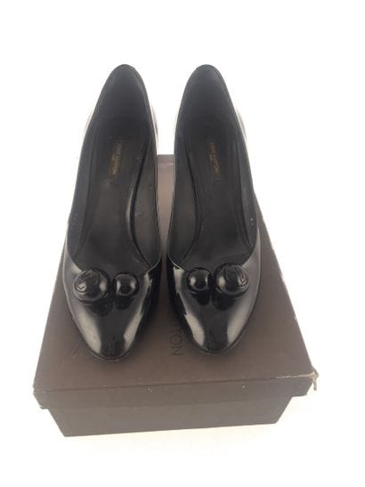 LOUIS VUITTON
Pair of black patent leather...