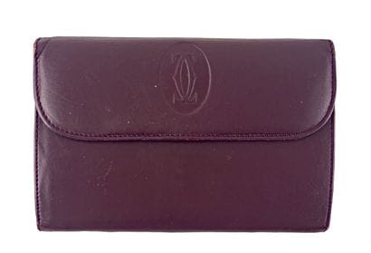 CARTIER Paris
Burgundy leather women's wallet,...