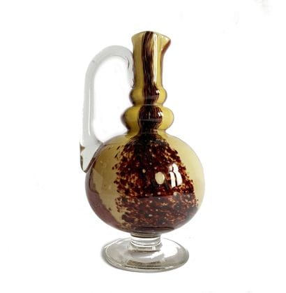 Small pitcher on a blown-glass pedestal with...