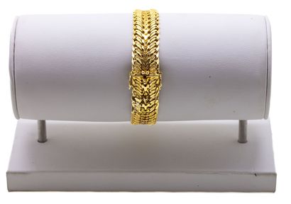 Large gourmette en or jaune 18 K (750/1000)...