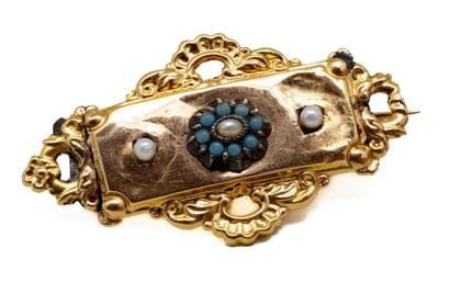 Broche en or jaune 18 K (750/1000), centrée...