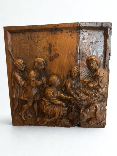 Carved wooden panel depicting the Adoration...