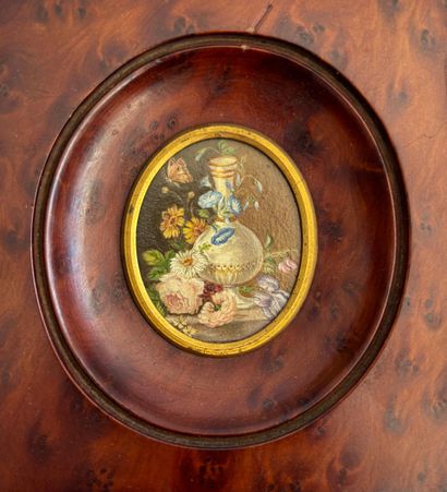 Oval miniature in oil on cardboard depicting...