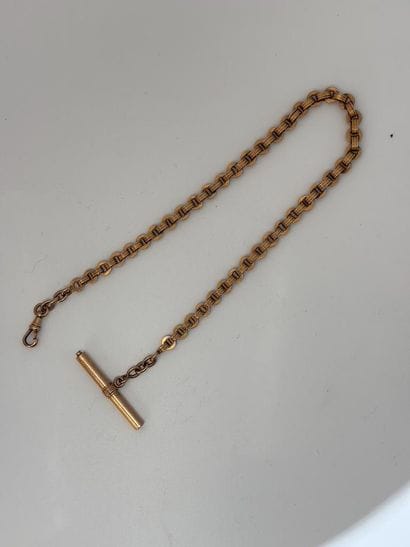 Watch chain and winding key in yellow gold...