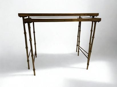 Maison Jansen. 
Two nesting tables in gilt...