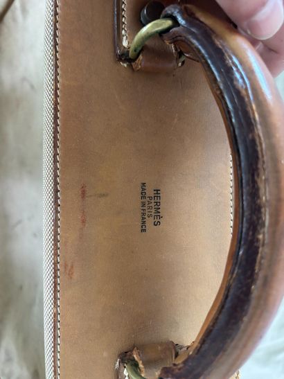 HERMES PARIS. 
Leather and ecru canvas suitcase....