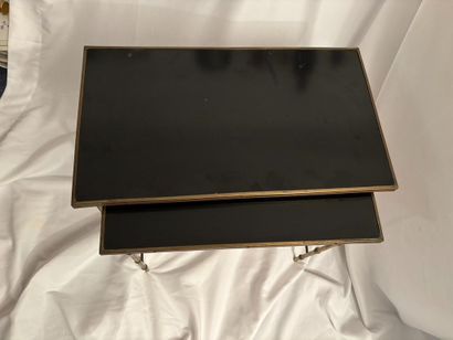 Maison Jansen. 
Two nesting tables in gilt...