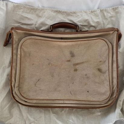 HERMES PARIS. 
Leather and ecru canvas suitcase....