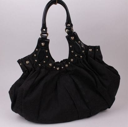 GUCCI 
Sac besace 35 cm en toile monogrammée...
