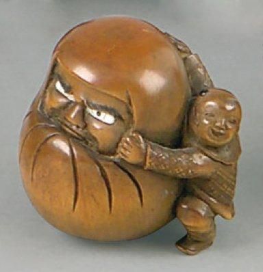 Netsuke en ivoire, enfant portant une énorme...