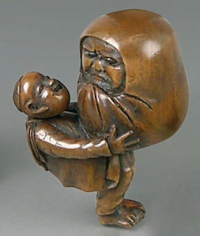 Netsuke en bois, personnage à la tête mobile...