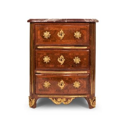 Rosewood chest of drawers, the curved front...
