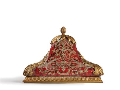 A red tortoiseshell and engraved brass inlaid...