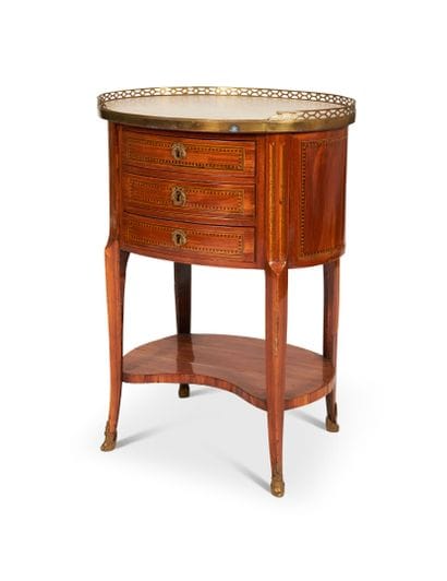 Oval writing table in fruitwood opening to...