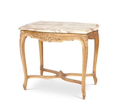 Carved and gilded wood table of mouvement...
