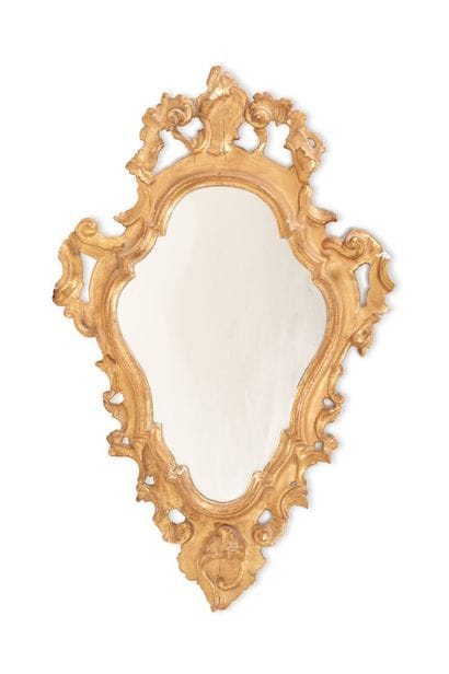 Gilded wood mirror of contoured form with...