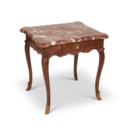 Walnut molded table, the scalloped belt opening...