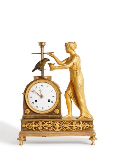 A patinated bronze and gilt bronze clock...