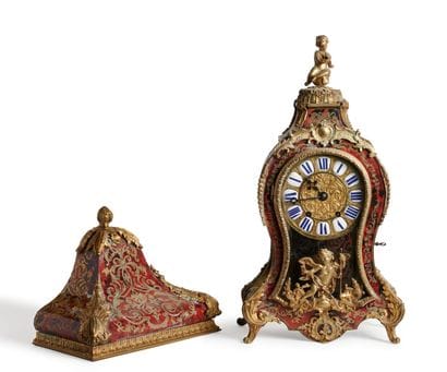 A red tortoiseshell and engraved brass inlaid...