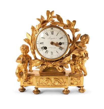 Gilt bronze clock decorated with children,...