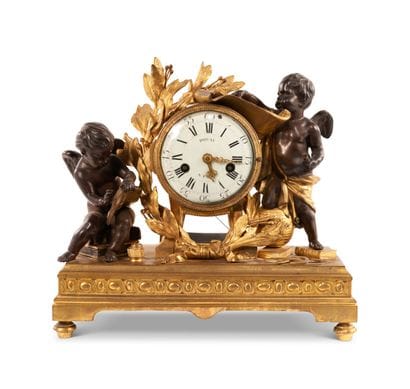 Clock in patinated bronze and gilded bronze...